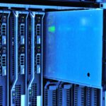 Detailed view of server racks with glowing lights in a data center environment.